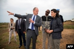 UN envoy for South Sudan David Shearer (L) briefs US Ambassador to the UN, Nikki Haley during a visit to the UN Protection of Civilians (PoC) site in Juba, South Sudan, on October 25, 2017.