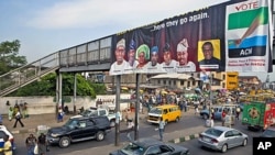 An election banner hangs on a pedestrian bridge in Mushin Neighborhood in Nigeria's commercial capital, Lagos, March 23, 2011