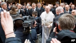 Pope Francis greets faithful at the Vatican, March 17, 2013. 