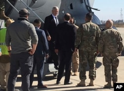 U.S. Secretary of Defense Jim Mattis, center, arrives at Baghdad International Airport, Iraq, on an unannounced trip, Feb. 20, 2017.