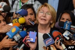 FILE - Venezuela's attorney general Luisa Ortega speaks to journalists outside the Supreme Court of Justice headquarters building in Caracas, June 13, 2017.