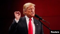 FILE - U.S. President-elect Donald Trump speaks at the USA Thank You Tour event at the Iowa Events Center in Des Moines, Iowa, Dec. 8, 2016.