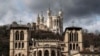 Katedral Saint-Jean (depan), dan Basilika Fourviere (atas), di Lyon, Prancis tengah, Kamis, 7 Maret 2019. (AP Photo/Laurent Cipriani) 