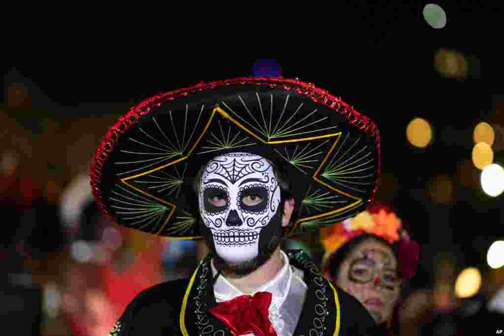 A Halloween reveler dressed in costume participates in New York City&#39;s 48th annual Greenwich Village Halloween Parade, Oct. 31, 2021.