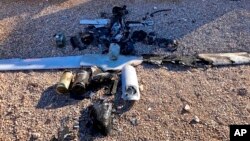 Wreckage of a drone is laid out near the Ain al-Asad air base, in the western Anbar province of Iraq, Jan. 4, 2022. Two explosives-laden drones targeting the base housing U.S. troops were destroyed by defensive capabilities at the base on Tuesday, a coalition official said.