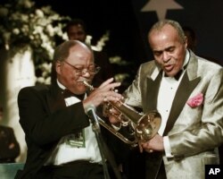 FILE - Jon Hendricks sings with trumpeter Clark Terry and the Count Basie Band at the Texas Inaugural Ball, Jan. 20, 1997, in Washington.