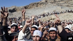 Afghans shout anti-American slogans during an anti-U.S. protest in Ghani Khail, east of Kabul, Afghanistan over the burning of Qurans at a U.S. military base, February 24, 2012 file photo