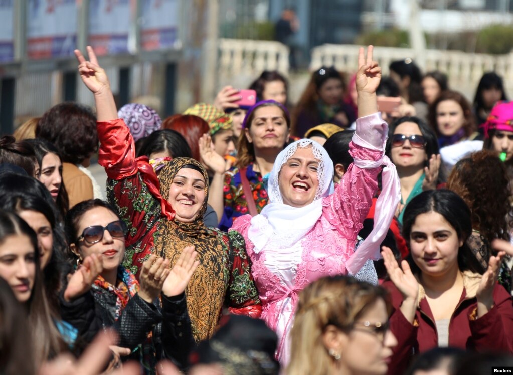 Participants dance during an International Women's Day rally in the Kurdish-dominated southeastern city of Diyarbakir, Turkey, March 8, 2017.