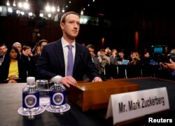 FILE - Facebook CEO Mark Zuckerberg arrives to testify before a Senate Judiciary and Commerce Committees joint hearing regarding the company’s use and protection of user data, on Capitol Hill in Washington, April 10, 2018.