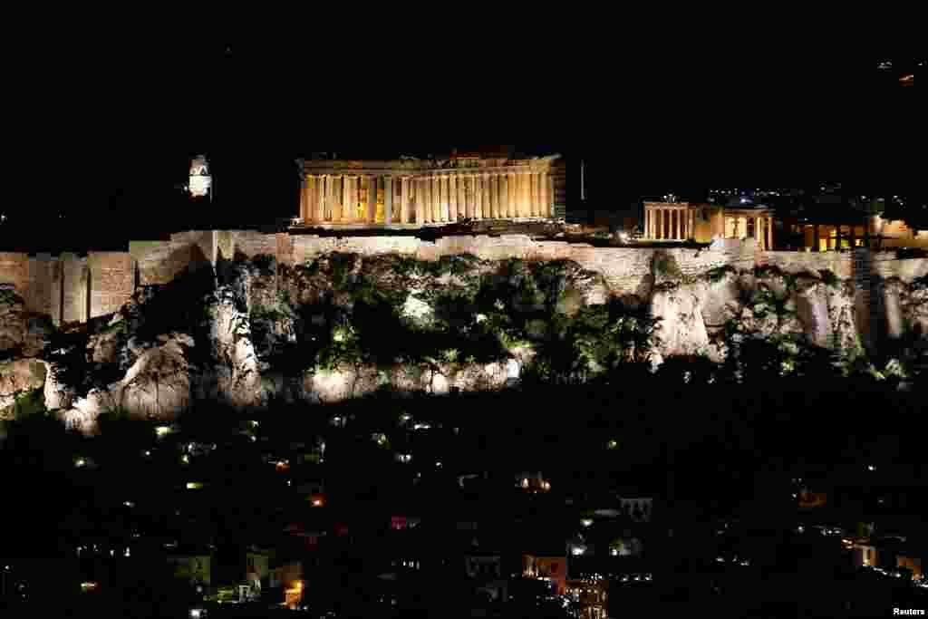 The ancient Parthenon temple is pictured atop the Acropolis hill before Earth Hour in Athens, Greece, March 30, 2019.