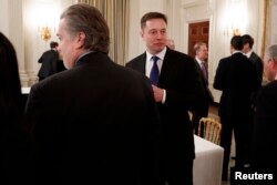 FILE - Tesla and SpaceX CEO Elon Musk arrives for a meeting between President Donald Trump and business leaders in the State Dining Room of the White House in Washington, Feb. 3, 2017.