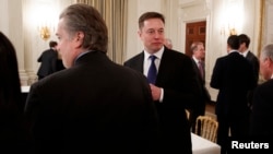 FILE - Tesla and SpaceX CEO Elon Musk arrives for a meeting between President Donald Trump and business leaders in the State Dining Room of the White House in Washington, Feb. 3, 2017.