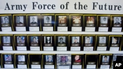 Pictured are photos of recruits hanging on the wall at the Wilkes County U.S. Army Recruiting Station April 30, 2008 (AP File photo)