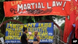 Filipino activists protest near the Malacanang Presidential Palace in Manila, Philippines, July 20, 2017, against Philippine President Rodrigo Duterte's proposed extension of martial law in the whole of Mindanao island until the end of the year.