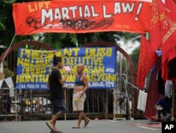 Filipino activists protest near the Malacanang Presidential Palace in Manila, Philippines, July 20, 2017, against Philippine President Rodrigo Duterte's proposed extension of martial law in the whole of Mindanao island until the end of the year.