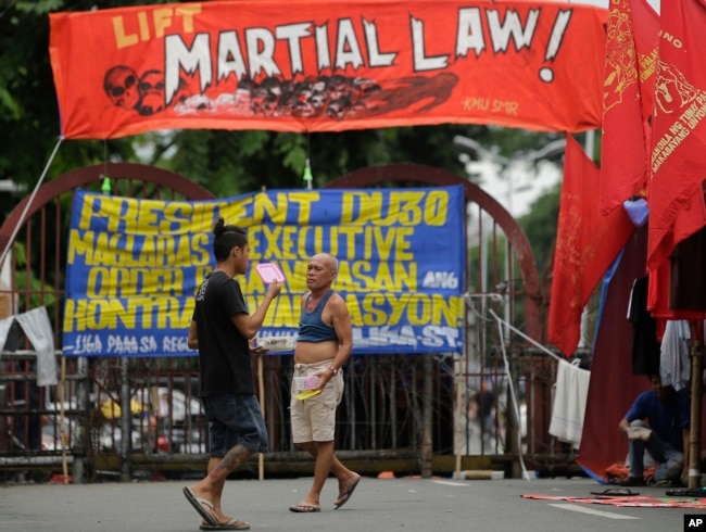 Filipino activists protest near the Malacanang Presidential Palace in Manila, Philippines, July 20, 2017, against Philippine President Rodrigo Duterte's proposed extension of martial law in the whole of Mindanao island until the end of the year.