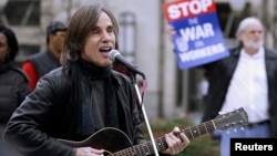 FILE - Singer-songwriter Jackson Browne performs at an Occupy DC rally in Washington's Freedom Plaza, Dec. 5, 2011. 