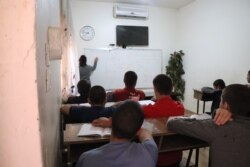 Boys at the Houri Center take classes in science, math, English and Arabic, in Tal Marouf, Syria, Oct. 24, 2021. (Heather Murdock/VOA)