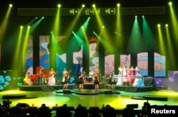 FILE - Members of the Moranbong Band perform in Pyongyang on July 7, 2012.