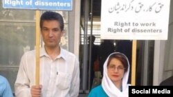 In this undated photo shared on social media, Iranian rights activist and physician Farhad Meysami attends a protest alongside his friend and human rights lawyer, Nasrin Sotoudeh. Another activist reported that Meysami, who was arrested, July 31, 2018, will expand a hunger strike to include giving up water beginning Sept. 8, 2018. 