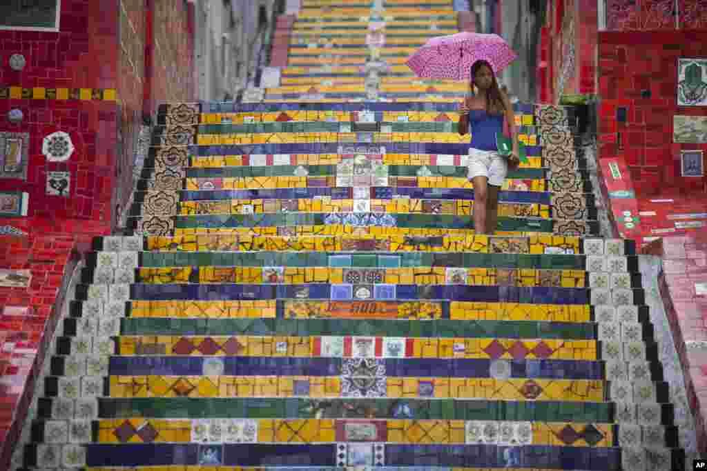 A woman descends a stairway that was decorated by Chilean artist Jorge Selaron, which he titled the &#39;Selaron Stairway&#39; in Rio de Janeiro, Brazil. Selaron, 54, an eccentric artist and longtime Rio resident, who created a massive, colorful tile stairway in the bohemian Lapa district, was found dead on the stairway.