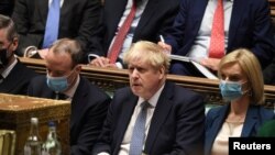FILE - British Prime Minister Boris Johnson attends the weekly Prime Minister's Questions at the parliament in London, Jan. 12, 2022. (UK Parliament/Jessica Taylor/Handout via Reuters)