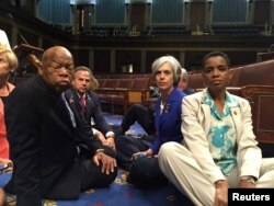 A photo tweeted from the floor of the U.S. House by Rep. Donna Edwards (R) shows Democratic members of the U.S. House of Representatives, including herself and Rep. John Lewis (L) staging a sit-in on the House floor.