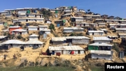 FILE - A deforested section of the Chakmakul camp for Rohingya refugees clings to a hillside in southern Bangladesh, Feb. 13, 2018. 