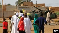 Members of Sudan's security forces patrol as Muslim worshippers attend Eid al-Fitr prayers marking the end of the holy fasting month of Ramadan, June 5, 2019, in Omdurman, across the Nile from the capital Khartoum. 