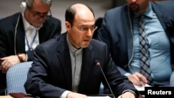FILE - Hossein Dehghani, Iran's deputy U.N. representative who is shown addressing the Security Council in July 2014, says a resolution condemning Iran for rights violations is a "selective and politicized distortion of facts." 