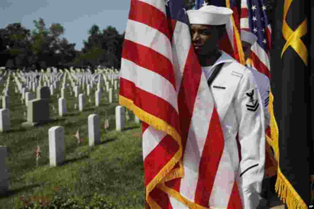 Honor Guard members line up for the Memorial Day Observance at the Memorial Amphitheater ahead of President Barack Obama's arrival at Arlington National Cemetery, Monday, May 28, 2012. (AP Photo/Charles Dharapak)