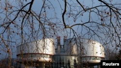 FILE - The building of the European Court of Human Rights is seen in Strasbourg.