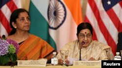 FILE - India's Minister of Commerce and Industry Nirmala Sitharaman, left, and External Affairs Minister Sushma Swaraj attend the U.S-India Strategic & Commercial Dialogue plenary session in Washington, Sept. 22, 2015.