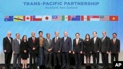 Trade representatives from the 12 member nations gather in Auckland, New Zealand for the formal signing of the Trans-Pacific Partnership Agreement.