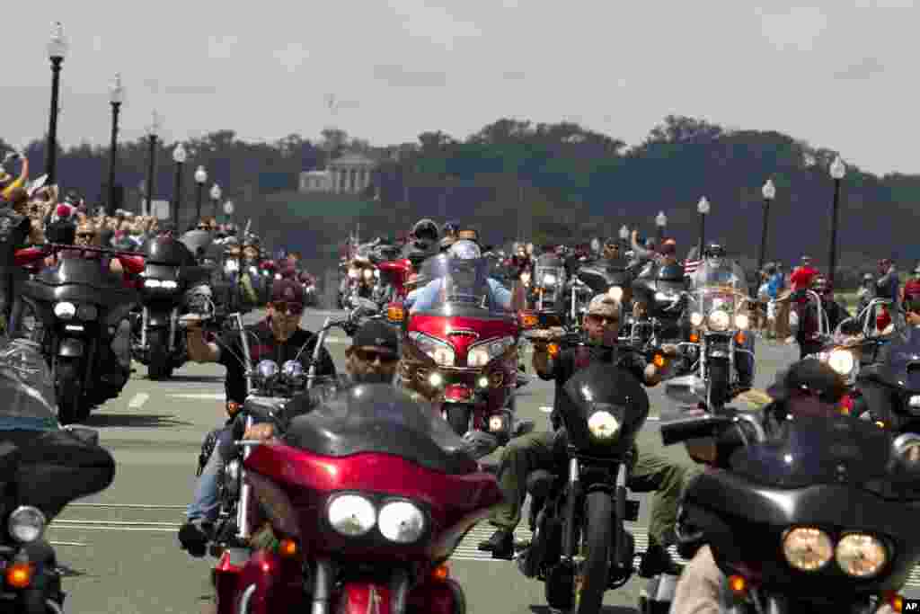 Participants in the Rolling Thunder motorcycle rally ride past Arlington Memorial Bridge, during the annual Rolling Thunder parade, ahead of Memorial Day, May 27, 2018, in Washington.