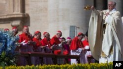 Pope Francis incenses the faithful as he arrives to celebrate an Easter Sunday Mass in St. Peter's Square at the Vatican Sunday, April 20, 2014.