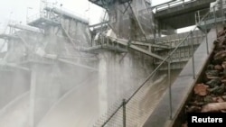 FILE - Ross River Dam releases water in Queensland, Australia, in this still photo from a February 3, 2019 video by Julia Hunt.