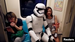 A fan dressed as a Storm Trooper from "Star Wars" reacts at the Taipei Metro (MRT) during Star Wars Day in Taipei, Taiwan, May 4, 2017. 
