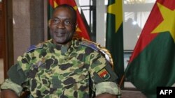 FILE - General Gilbert Diendere sits at the presidential palace in Ouagadougou, Sept. 17, 2015. Soldiers were arrested for plotting to free Diendere from prison.