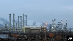 FILE - This Jan. 15, 2011 file photo shows the heavy water nuclear facility near Arak, 150 miles (250 kilometers) southwest of the capital Tehran, Iran. Iran will break the uranium stockpile limit set by Tehran's nuclear deal with world powers