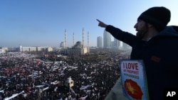 Chechen Muslims gather in downtown regional capital of Grozny to take part in a protest rally against the French satirical weekly Charlie Hebdo, Jan. 19, 2015.