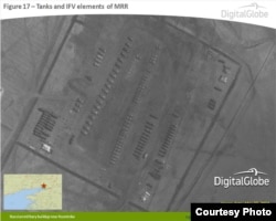 An image released by NATO on April 10, 2014 that shows tanks and infantry fighting vehicle elements of the Russian Motor Rifle Regiment near Kuzminka, Russia, near Ukraine. (DigitalGlobe/NATO ACO PAO)