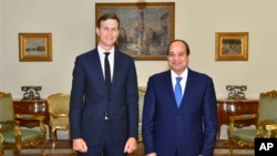 In this photo provided by Egypt's state news agency, MENA, Egypt's President Abdel-Fattah el-Sissi, right, poses for a photo with White House adviser Jared Kushner, in Cairo, Egypt, Wednesday, Aug. 23, 2017. 