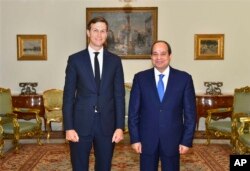 In this photo provided by Egypt's state news agency, MENA, Egypt's President Abdel-Fattah el-Sissi, right, poses for a photo with White House adviser Jared Kushner, in Cairo, Egypt, Wednesday, Aug. 23, 2017.