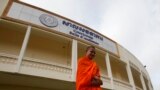 FILE - A Buddhist monk walks in front of a court room at the Extraordinary Chambers in the Courts of Cambodia (ECCC), on the outskirt of Phnom Penh October 16, 2013. 