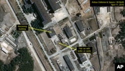 In this image provided by 38 North, shows a rail flatcar at radiochemical laboratory where North Korea separates weapons-grade plutonium from waste from a nuclear reactor. U.S. researchers see further signs from satellite imagery that North Korea is looki