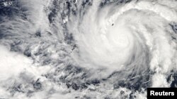 Typhoon Hagupit in the western Pacific Ocean is captured by NASA's Aqua satellite, December 3, 2014.
