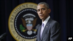 FILE - President Barack Obama in the South Court Auditorium in the Eisenhower Executive Office Building on the White House complex in Washington.