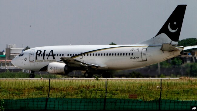 FILE - A Pakistani International Airline plane moments before take off in Islamabad, June 8, 2013.
