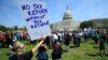 FILE - Protesters gather on Capitol Hill in Washington during a Tax Day demonstration calling on President Donald Trump to release his tax returns, April 15, 2017. 